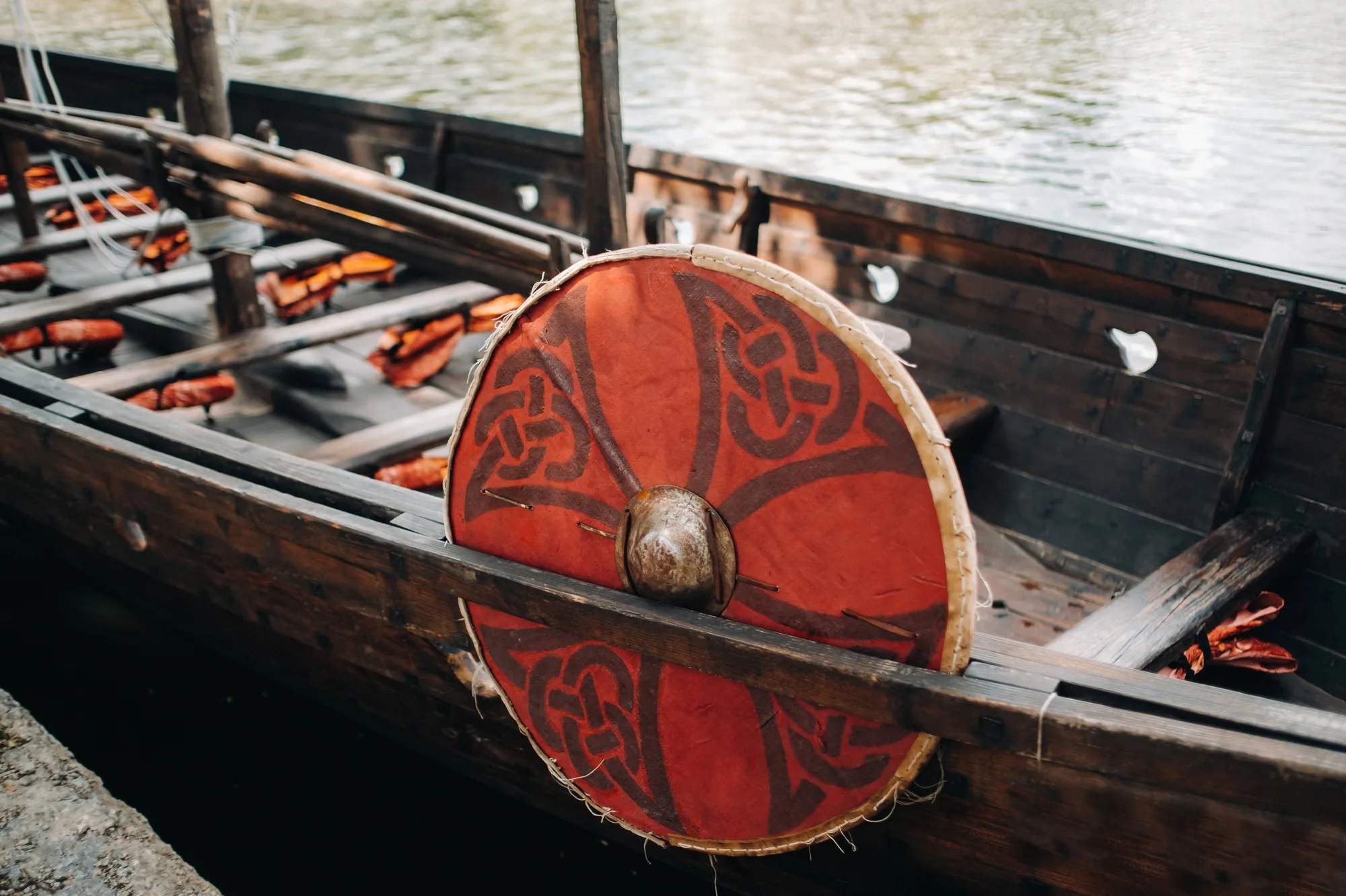An antique Viking ship on the river. Old boat