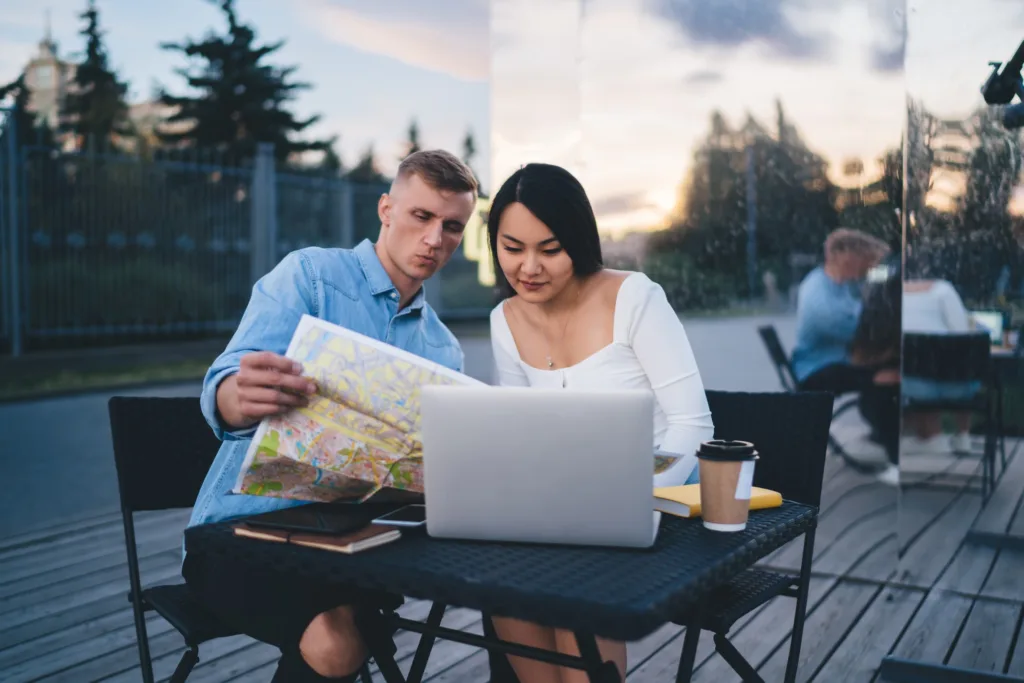 Male and female wanderers discussing travel tourism