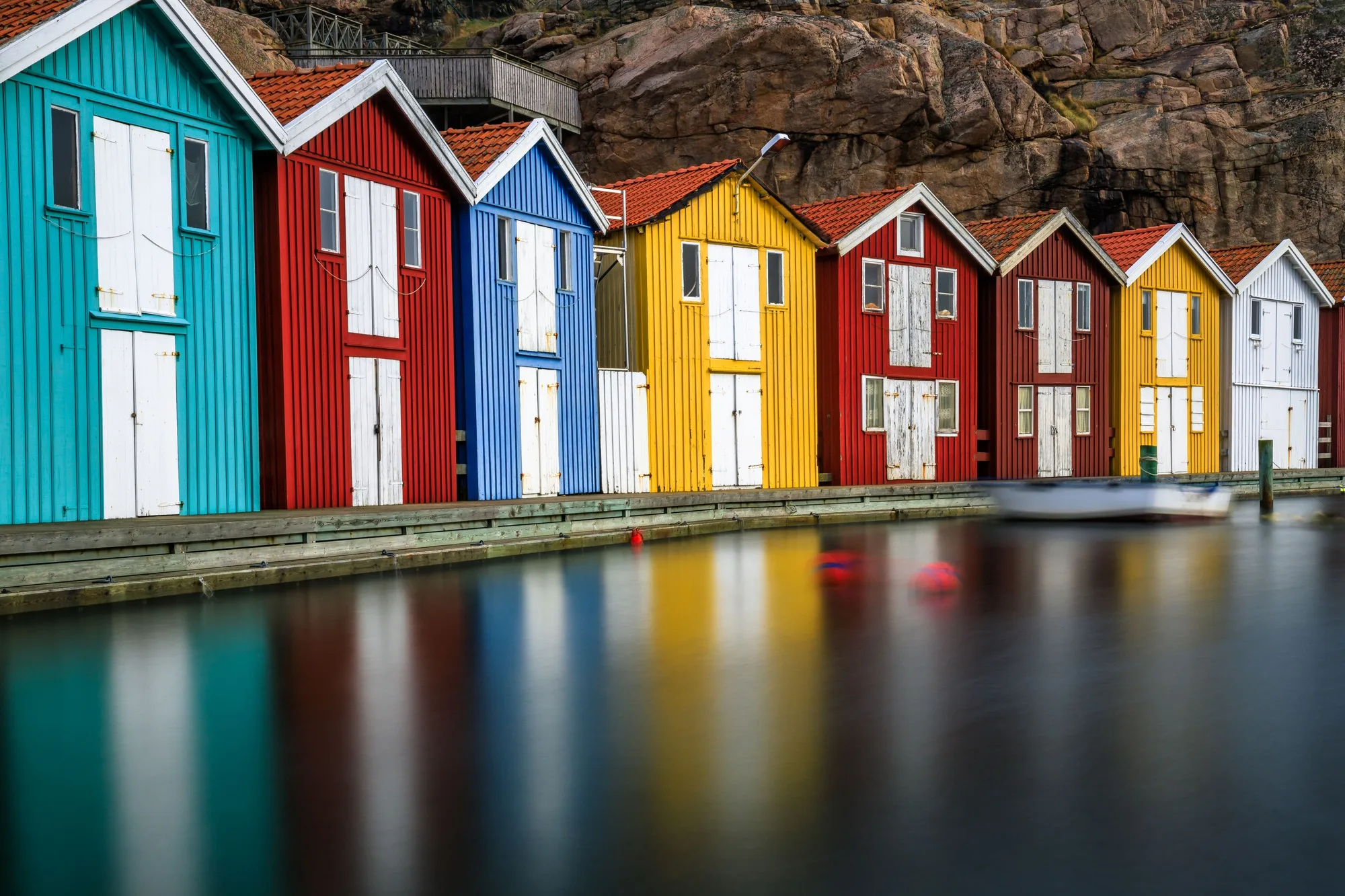 Serene landscape featuring an array of brightly colored houses: typical Swedish houses in Smogen